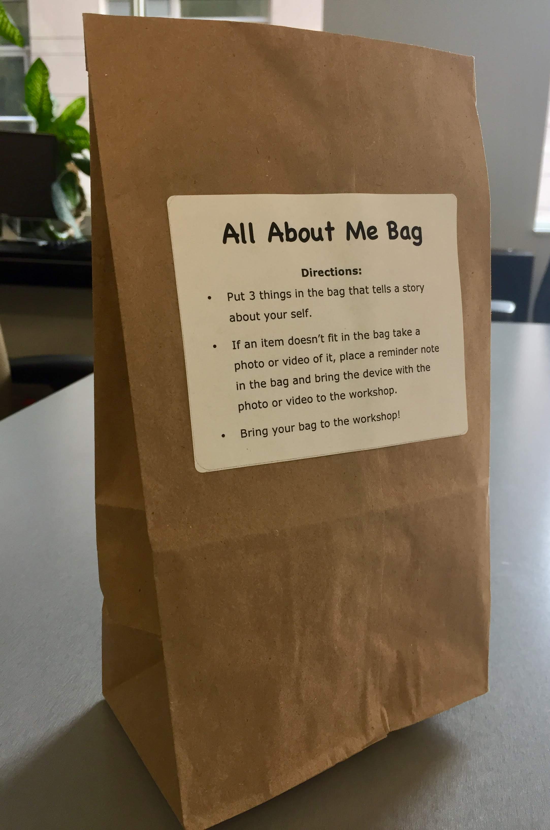 Paper bag with All About Me Bag 3-step instructions label stuck on the front